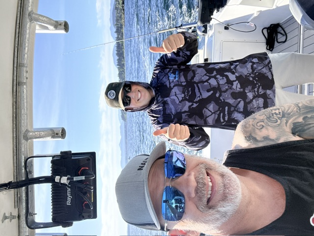 Captain Randy and a guest fishing offshore