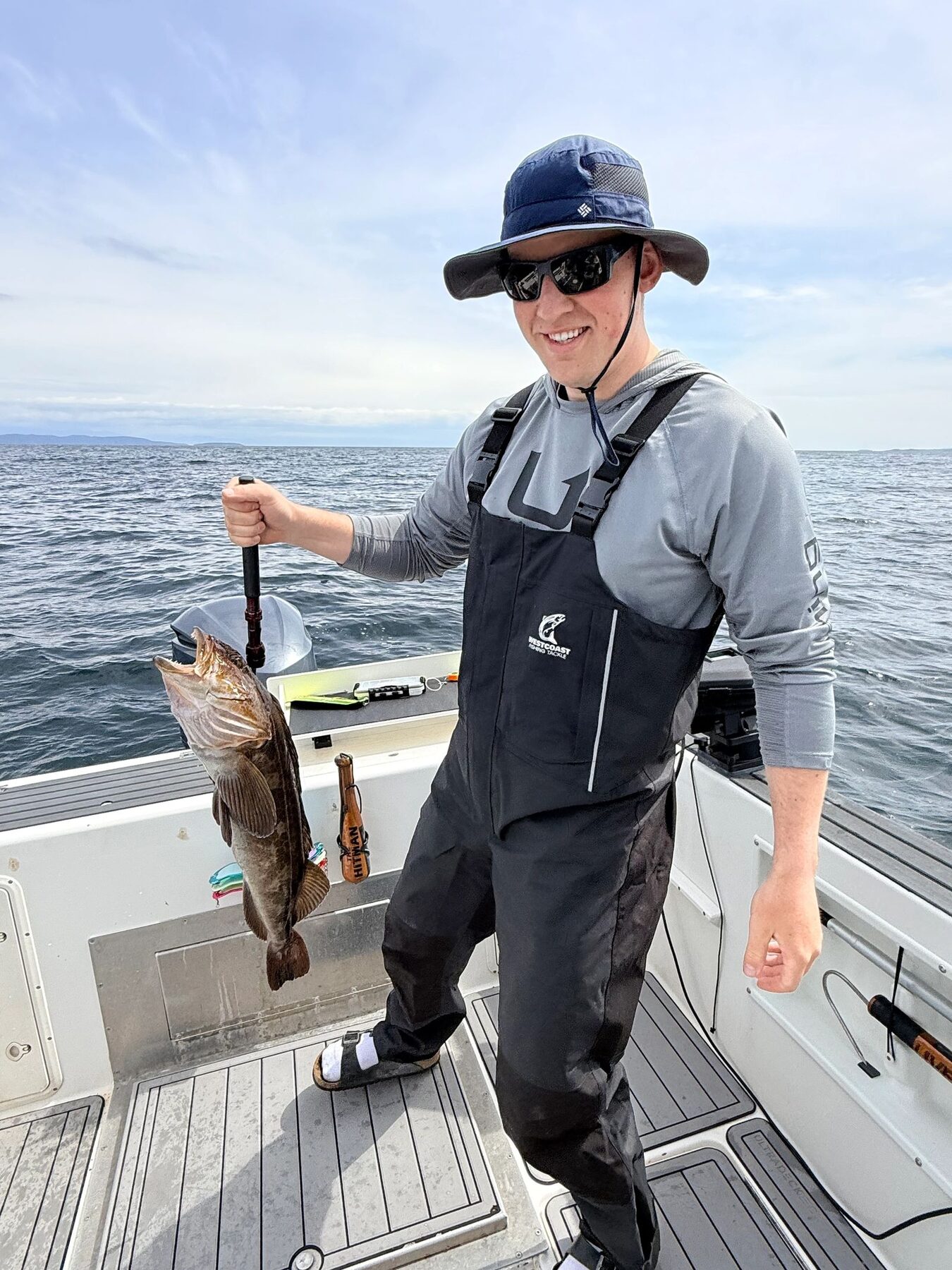 Captain Randy Zinck holding a fish aboard the charter boat