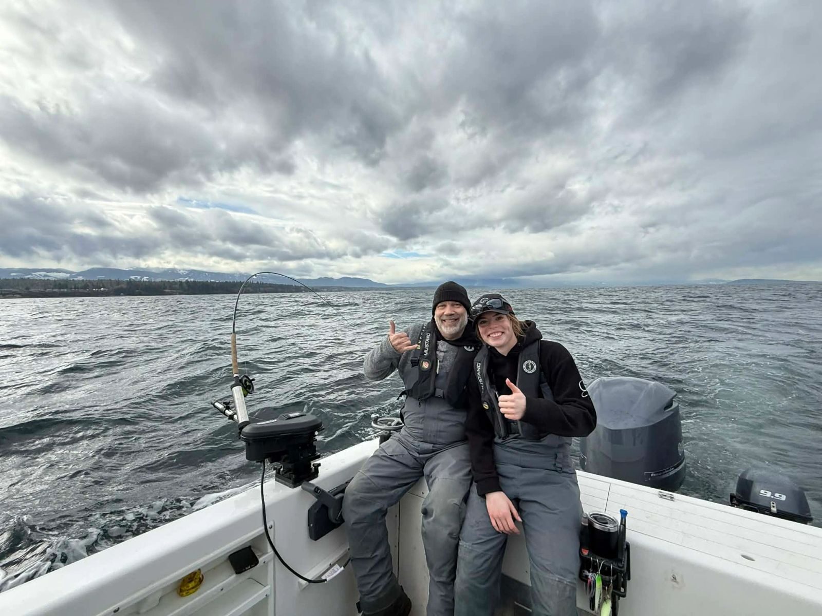 Guide and guest enjoying a private fishing charter near Parksville